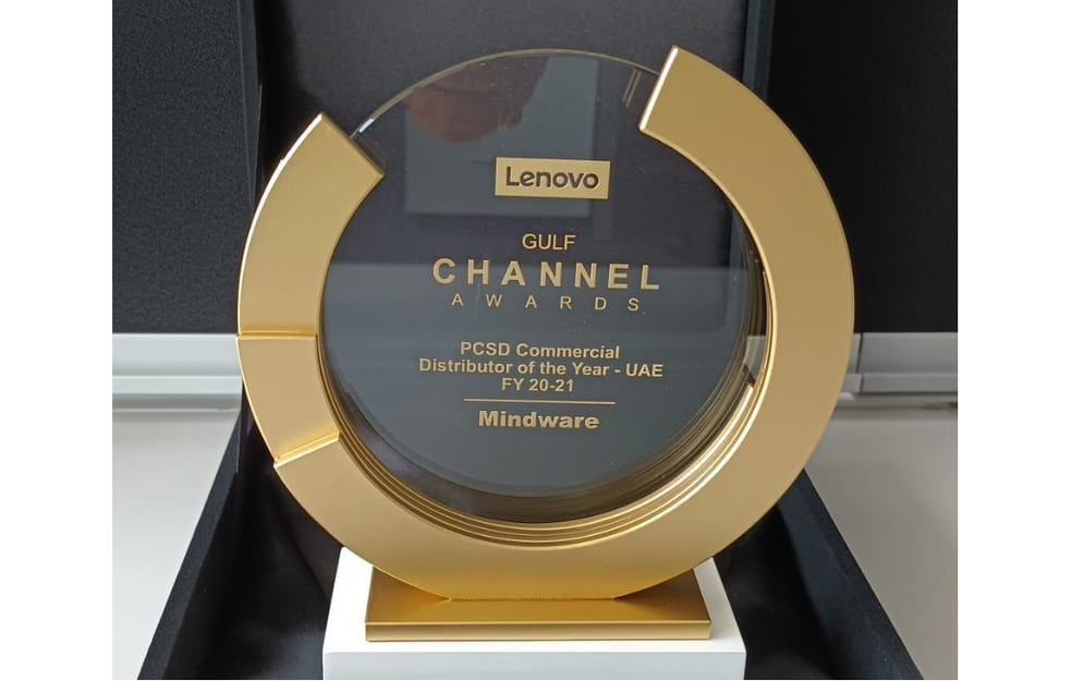 a gold and glass trophy with the word Mindware prominent on it