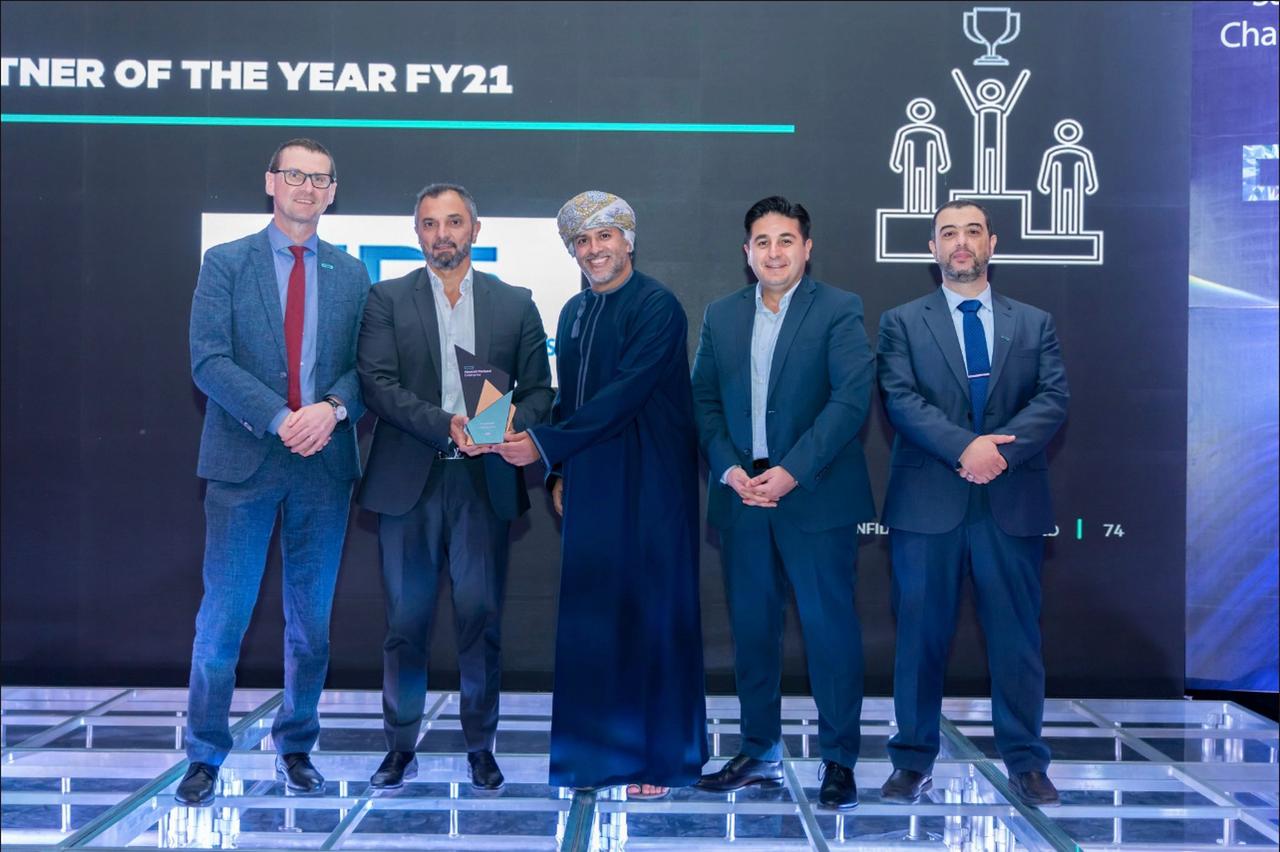 five men seen at a trophy presentation