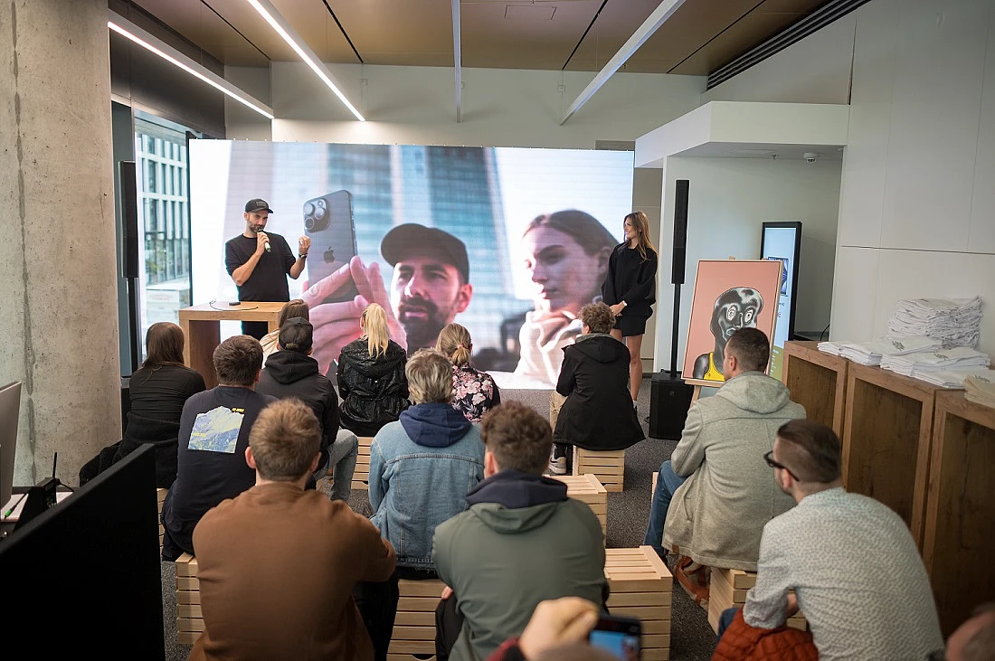 a group of people are seen watching a presentation