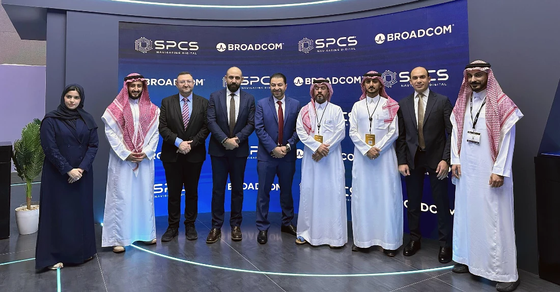 Nine people in a group photograph at a hi tech event