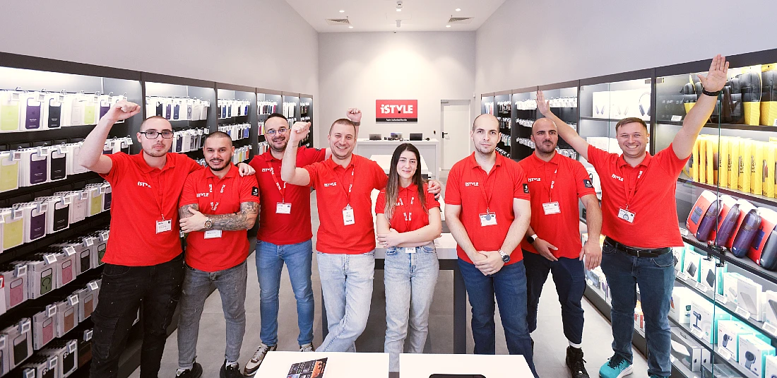 group photo of a team of people in a hi tech store